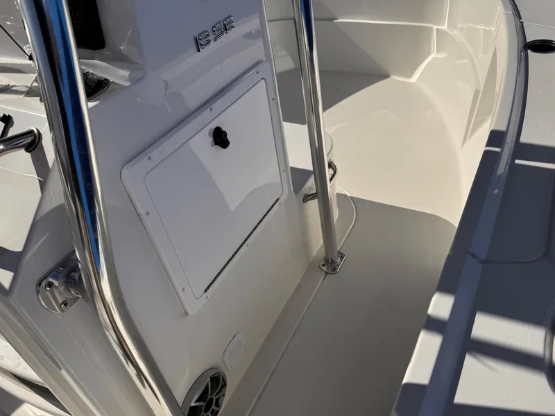 Slide: The Image of 2025 Parker 18SE Center Console boat interior with sleek design and storage compartment. - 27