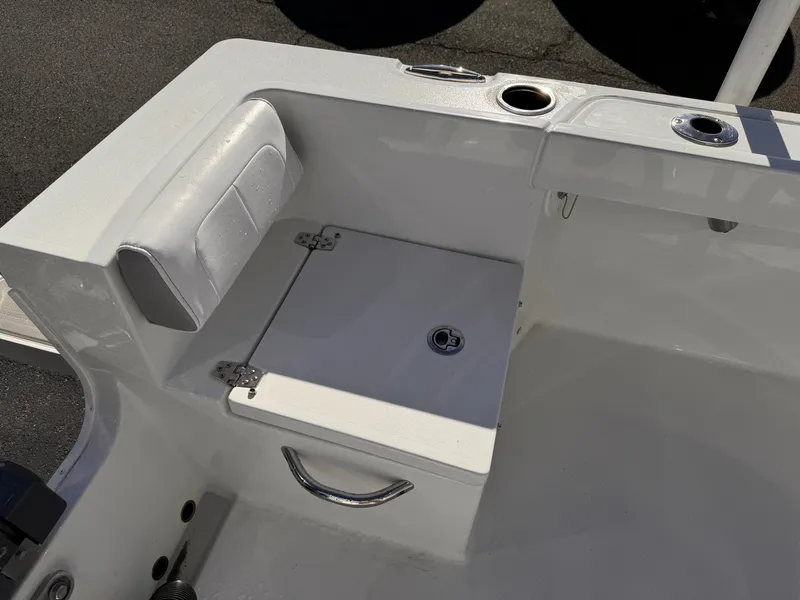 Slide: The Image of 2025 Parker 18SE Center Console boat interior with seating and storage compartment. - 31
