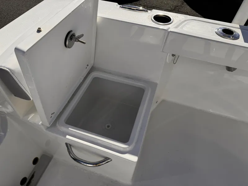 Slide: The Image of 2025 Parker 18SE Center Console boat with open storage compartment. - 32
