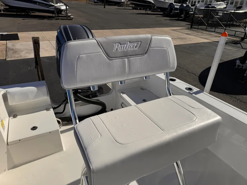 Slide: The Image of 2025 Parker 18SE Center Console boat seat, white upholstery, outdoor setting. - 35
