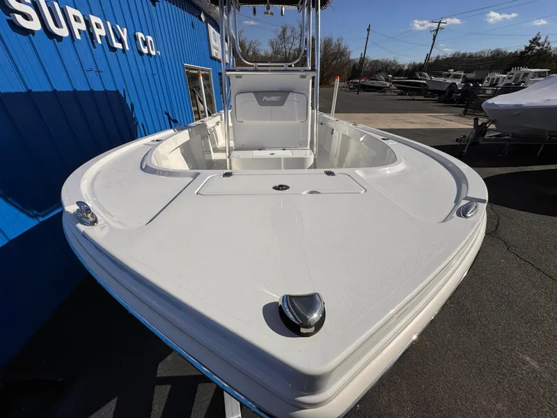 Slide: The Image of 2025 Parker 18SE Center Console boat at a supply company, viewed from the bow. - 5