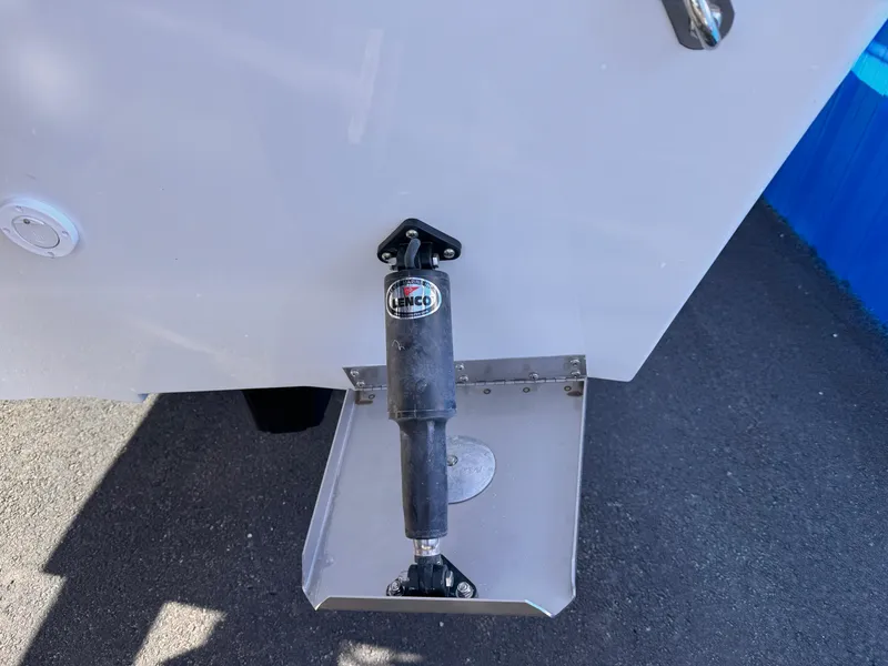 Slide: The Image of Trim tab on 2025 Parker 18SE Center Console boat, featuring Lenco actuator. - 6