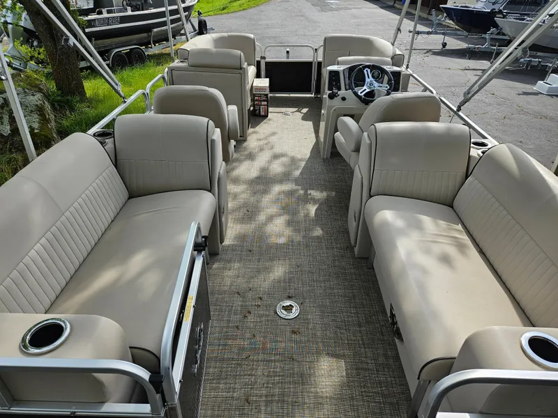 Slide: The Image of 2018 Apex Marine Qwest LS 820 RLS pontoon boat with spacious seating and steering console. - 14