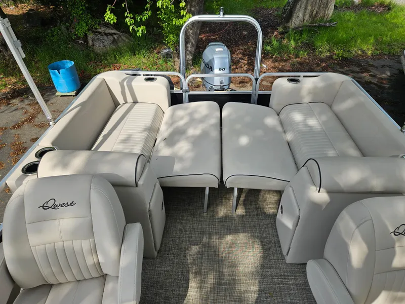 Slide: The Image of 2018 Apex Marine Qwest LS 820 RLS pontoon boat with beige seating and outboard motor. - 6