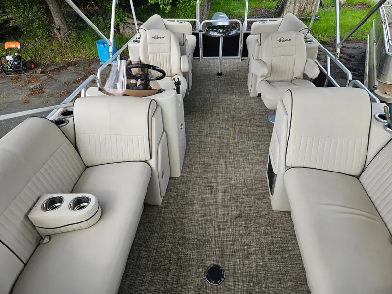 Slide: The Image of 2018 Apex Marine Qwest LS 820 RLS pontoon boat with beige seating and steering console. - 7