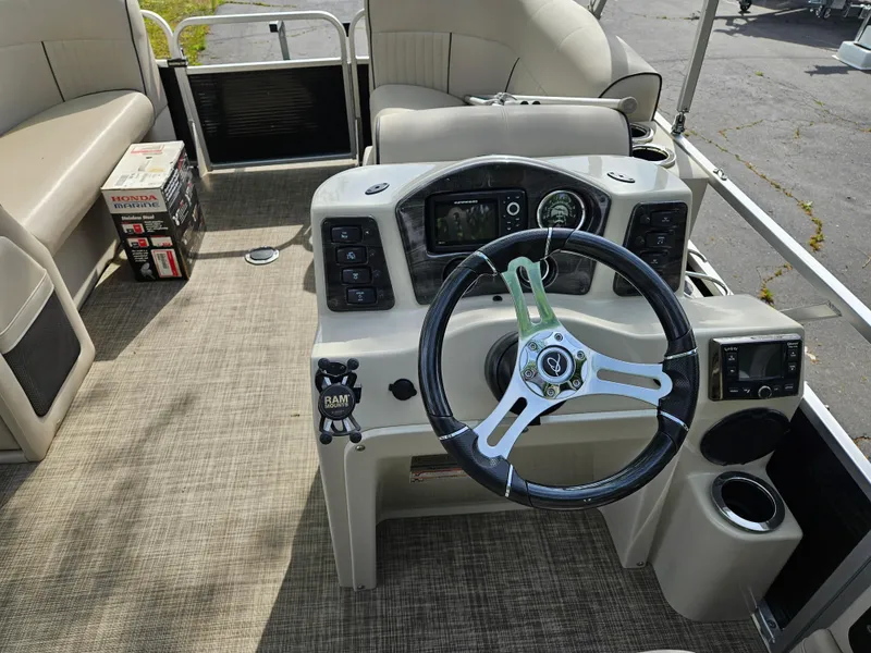 Slide: The Image of 2018 Apex Marine Qwest LS 820 RLS boat interior with steering console and seating. - 8
