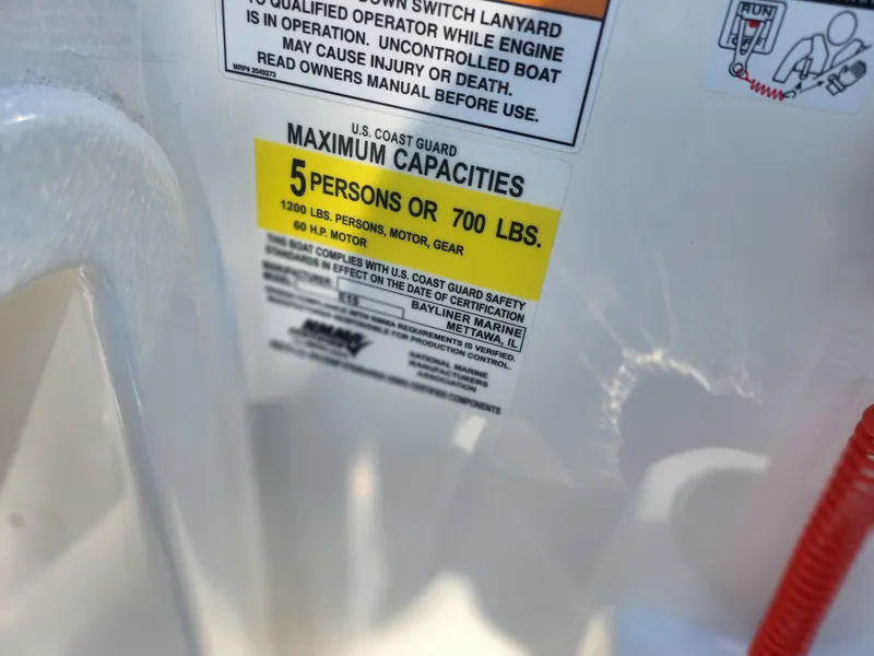 Slide: The Image of 2023 Bayliner Element M15 capacity label: 5 persons or 700 lbs, 80 HP motor. - 12