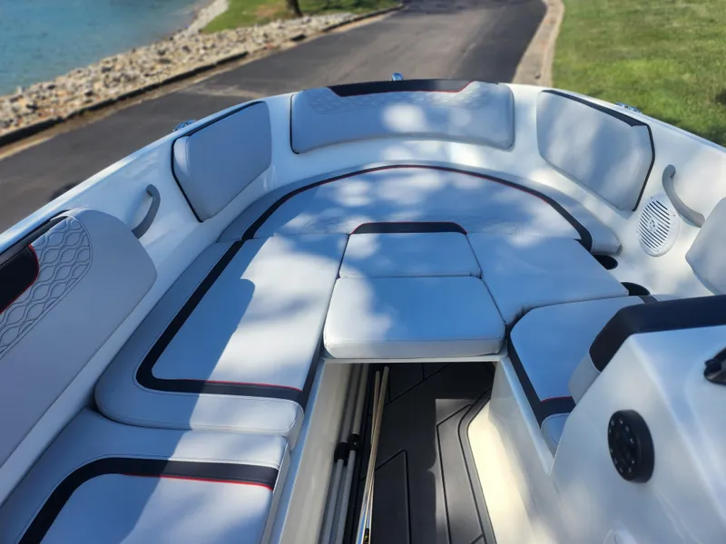 Slide: The Image of 2023 Bayliner Element M15 boat interior with cushioned seating and sleek design. - 14