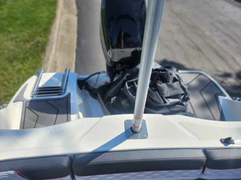 Slide: The Image of 2023 Bayliner Element M15 boat, rear view with motor and seating area. - 18