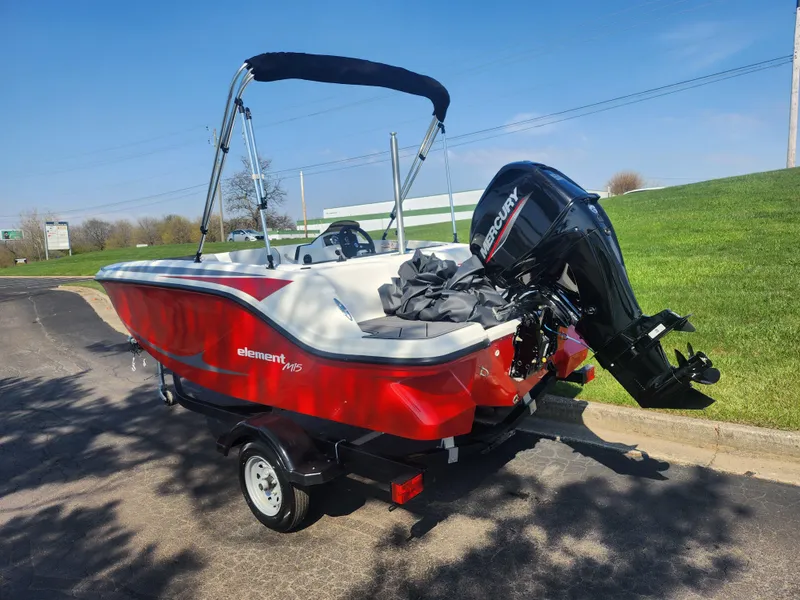 Slide: The Image of 2023 Bayliner Element M15 boat with Mercury outboard motor on a trailer. - 3