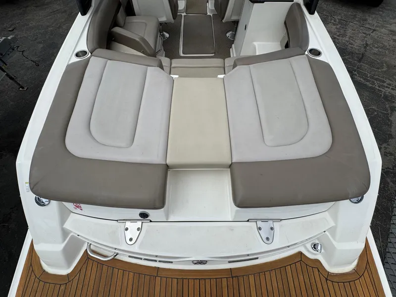 Slide: The Image of 2012 Sea Ray 250 SLX boat with spacious seating and teak deck. - 17