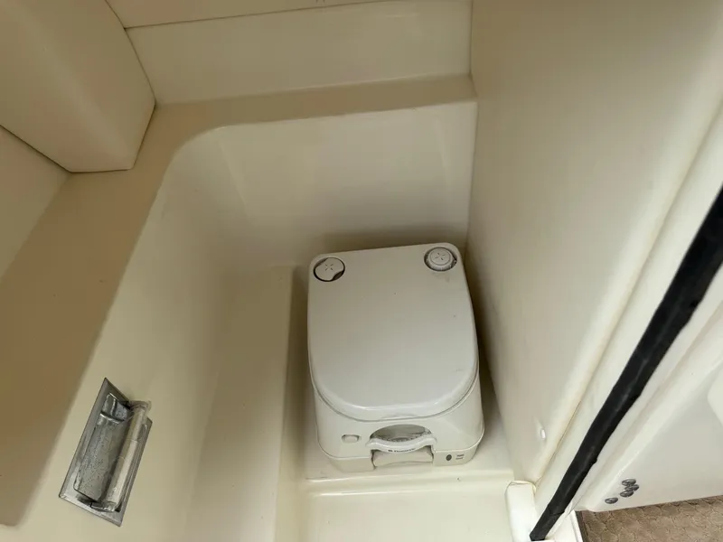 Slide: The Image of Portable toilet in 2012 Sea Ray 250 SLX boat bathroom compartment. - 27