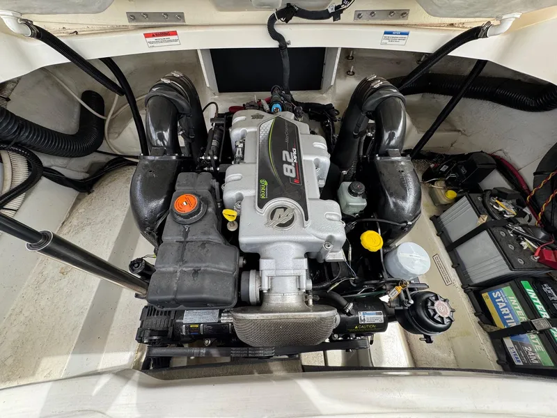 Slide: The Image of Engine compartment of a 2012 Sea Ray 250 SLX boat, featuring a powerful 8.2-liter engine. - 31