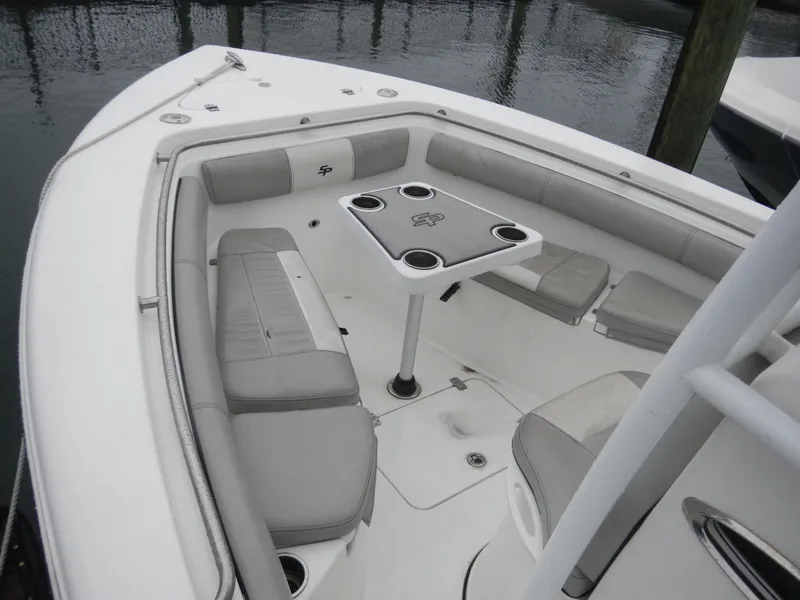 Slide: The Image of 2018 Sea Pro 219 Center Console boat with cushioned seating and table. - 10