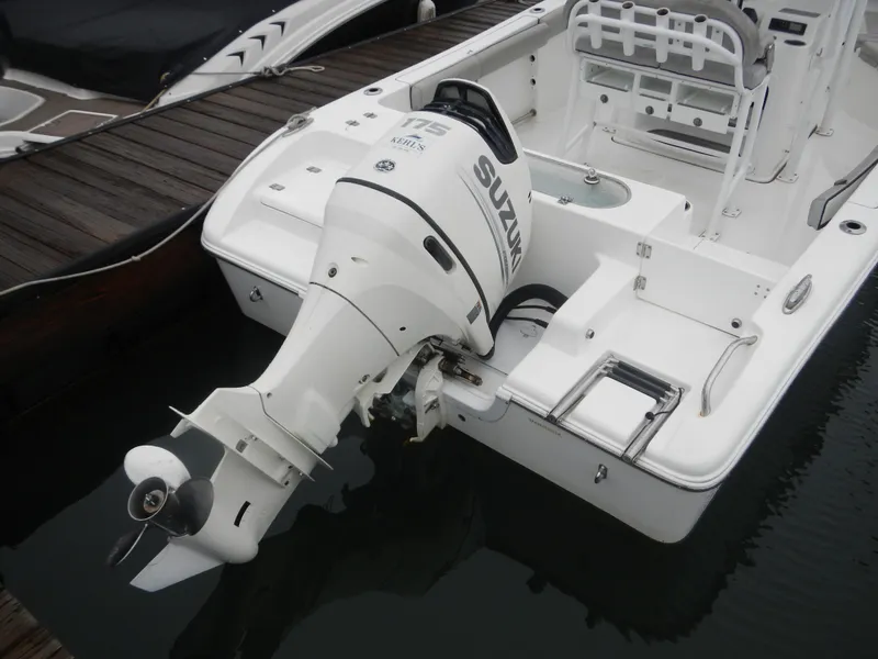 Slide: The Image of 2018 Sea Pro 219 Center Console boat with Suzuki outboard motor at dock. - 3