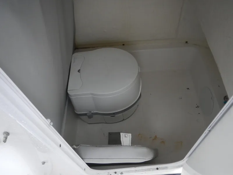 Slide: The Image of 2018 Sea Pro 219 Center Console boat toilet interior. - 6