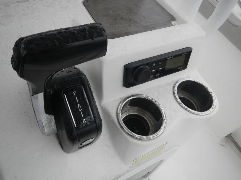 Slide: The Image of 2018 Sea Pro 219 Center Console boat controls with dual cup holders. - 7