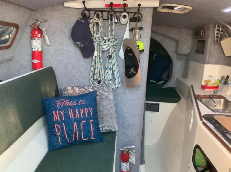 Slide: The Image of Sailboat docked in marina, Corsair F-31, 1996 model, with blue covers and clear sky. - 3