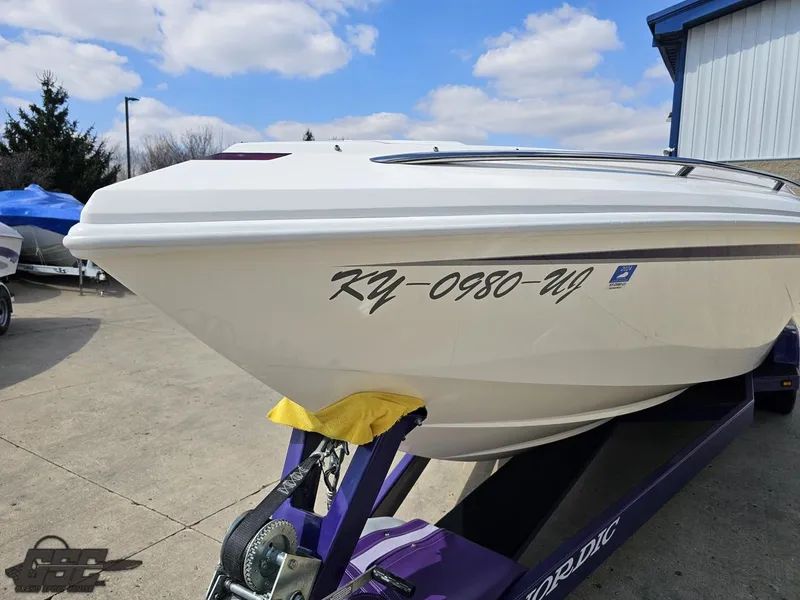 Slide: The Image of 2007 Nordic 28 Heat MCOB boat on trailer, registration KY-0980-WY, parked outdoors. - 21