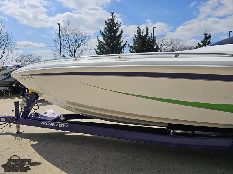 Slide: The Image of Nordic 28 Heat MCOB boat on trailer, 2007 model, parked outdoors under blue sky. - 24
