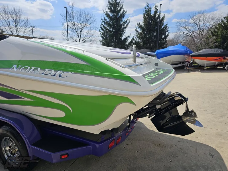 Slide: The Image of Nordic 28 Heat MCOB boat, 2007 model, with green and white design on a trailer. - 31