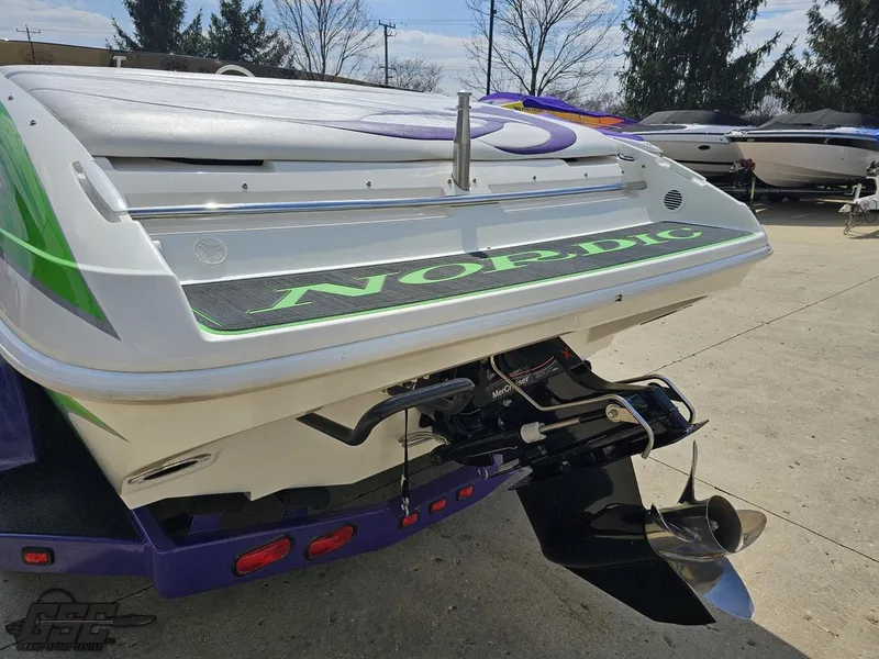 Slide: The Image of Rear view of a 2007 Nordic 28 Heat MCOB boat with visible propeller. - 32