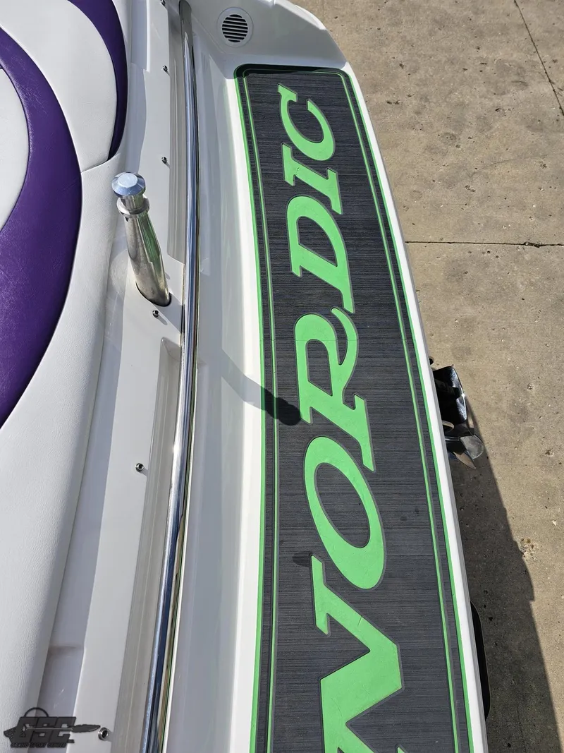 Slide: The Image of Nordic 28 Heat MCOB boat, 2007 model, featuring green branding on deck. - 39