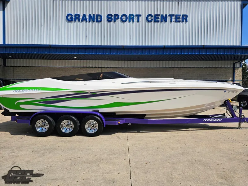 Slide: The Image of 2007 Nordic 28 Heat MCOB boat at Grand Sport Center, featuring green and purple accents. - 4