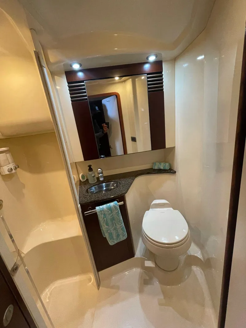 Slide: The Image of 2006 Sea Ray 44 Sedan Bridge bathroom with modern fixtures and elegant design. - 16