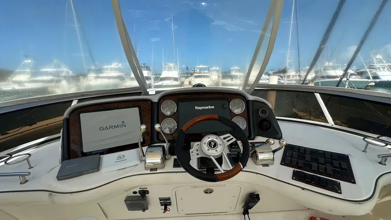 Slide: The Image of Helm of 2006 Sea Ray 44 Sedan Bridge with Garmin and Raymarine navigation systems. - 17