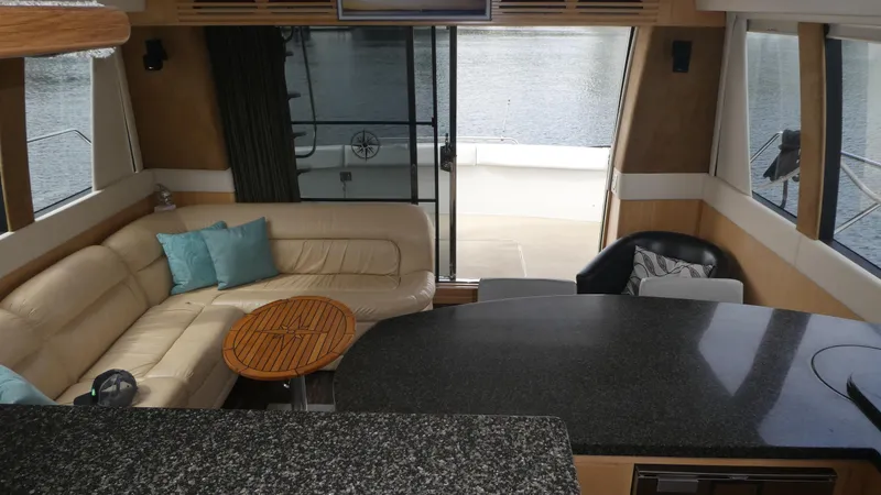 Slide: The Image of Luxurious interior of 1998 Carver 530 Voyager Pilothouse with leather seating and modern design. - 11