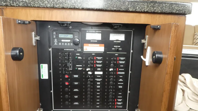 Slide: The Image of Electrical control panel inside a 1998 Carver 530 Voyager Pilothouse yacht. - 15