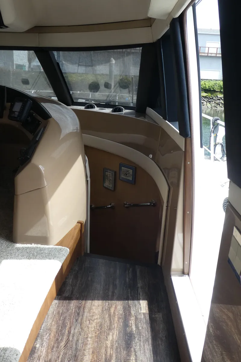 Slide: The Image of Interior view of 1998 Carver 530 Voyager Pilothouse with wood flooring and helm station. - 22