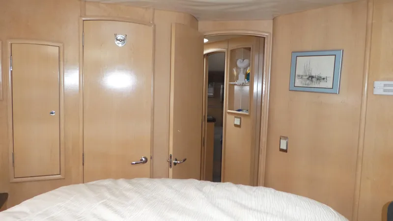 Slide: The Image of Interior of 1998 Carver 530 Voyager Pilothouse with wood paneling and framed artwork. - 29