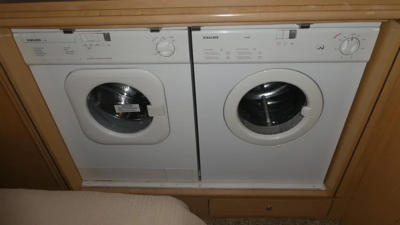 Slide: The Image of Built-in washer and dryer in 1998 Carver 530 Voyager Pilothouse yacht. - 36