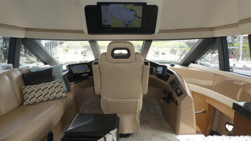 Slide: The Image of Interior of 1998 Carver 530 Voyager Pilothouse with modern navigation equipment. - 42