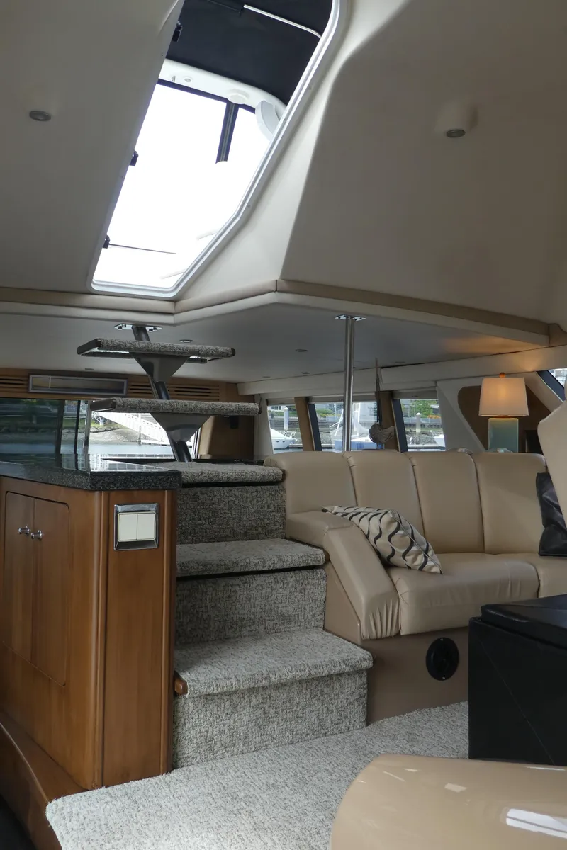 Slide: The Image of Interior of 1998 Carver 530 Voyager Pilothouse with plush seating and modern design. - 44
