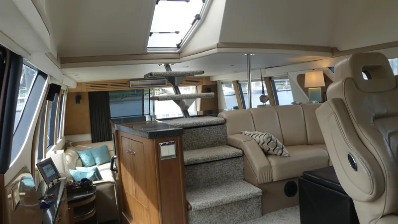 Slide: The Image of Interior of 1998 Carver 530 Voyager Pilothouse with luxurious seating and modern design. - 45