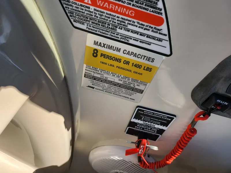 Slide: The Image of 2004 Sea Ray 225 Weekender capacity warning labels, maximum 8 persons or 1400 lbs. - 12