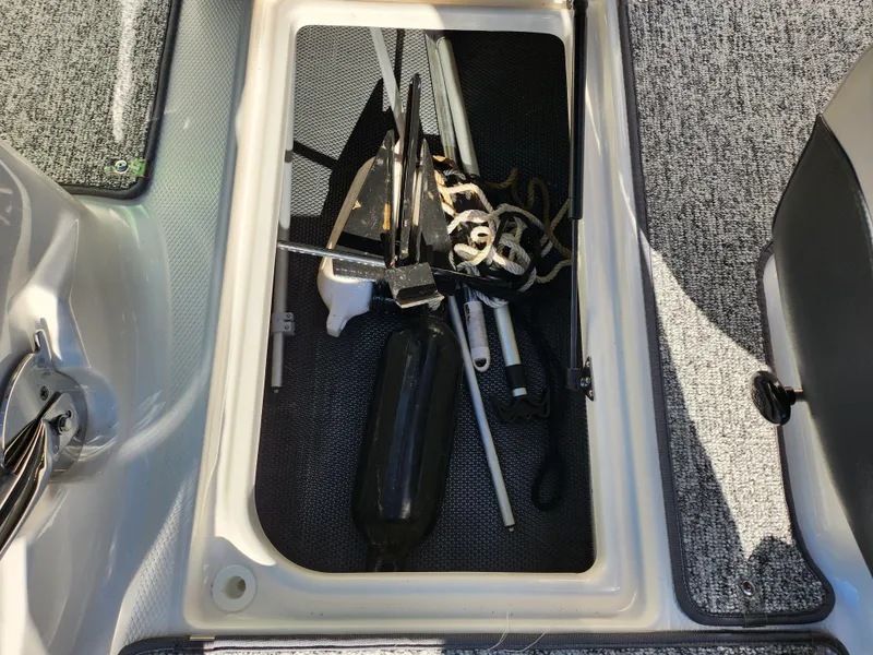 Slide: The Image of Storage compartment of 2016 Chaparral Vortex 203 VRX with boating accessories. - 13