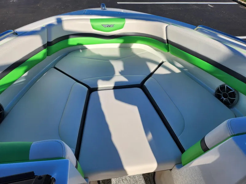 Slide: The Image of 2016 Chaparral Vortex 203 VRX boat interior with green and gray seating. - 17