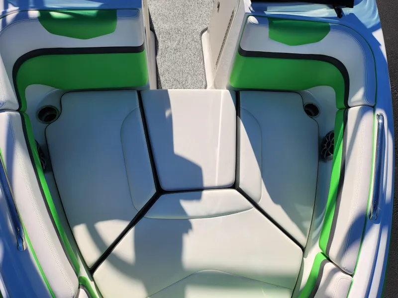 Slide: The Image of 2016 Chaparral Vortex 203 VRX boat interior with green and white seating. - 18