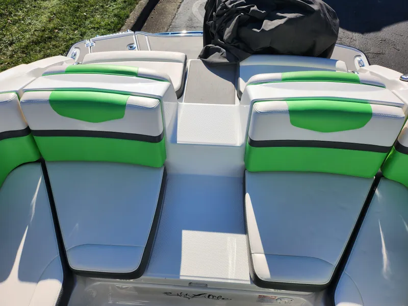 Slide: The Image of 2016 Chaparral Vortex 203 VRX boat with green and white seating. - 21