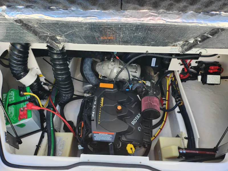 Slide: The Image of Engine compartment of a 2016 Chaparral Vortex 203 VRX boat, featuring a Rotax engine. - 22