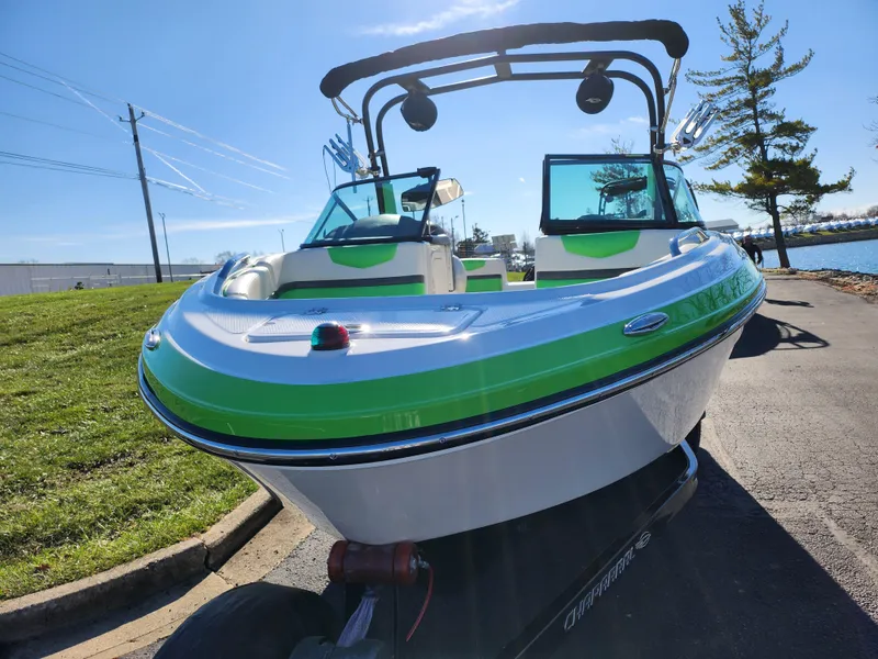 Slide: The Image of 2016 Chaparral Vortex 203 VRX boat with green accents on a sunny day. - 6