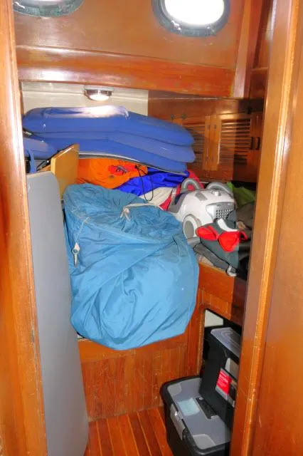 Slide: The Image of Interior storage area of a 1978 Brewer 45 Ketch sailboat with various items. - 11