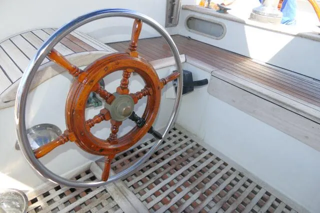 Slide: The Image of Wooden steering wheel on 1978 Brewer 45 Ketch sailboat deck. - 27