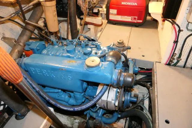 Slide: The Image of Engine room of 1978 Brewer 45 Ketch with Perkins engine and Honda generator. - 45
