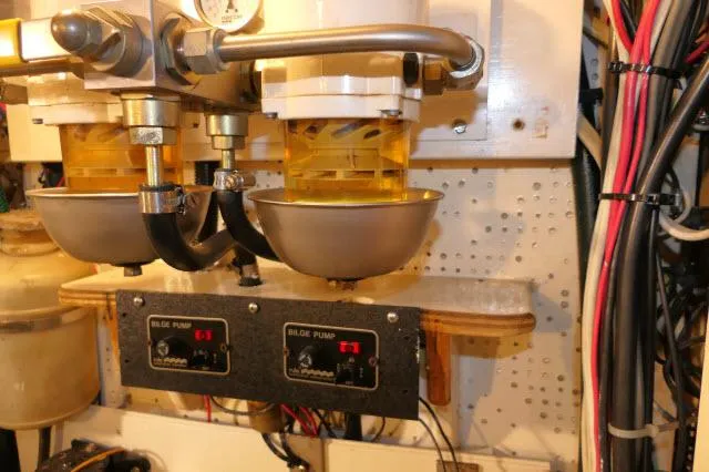 Slide: The Image of Engine room of 1978 Brewer 45 Ketch with bilge pump controls and wiring. - 46