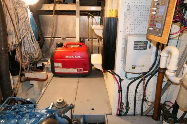 Slide: The Image of Engine room of 1978 Brewer 45 Ketch with Honda generator and electrical panel. - 48